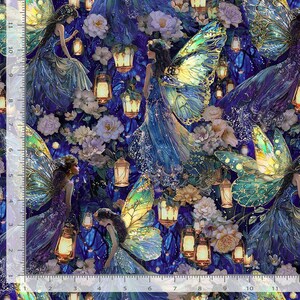 May include: A fabric print featuring multiple winged fairies in blue and purple gowns surrounded by glowing lanterns and light-colored flowers. A ruler along the left and bottom edges shows measurements in inches, indicating a repeating pattern design.