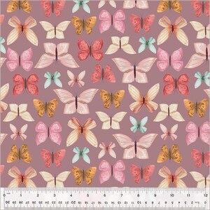 May include: A seamless pattern featuring a variety of colourful butterflies with different wing shapes and patterns on a light purple background.