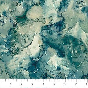 May include: Abstract fabric with a watercolour effect in shades of teal, blue, and cream. The design features organic shapes and patterns, with a ruler along the bottom showing measurements up to 20 cm.