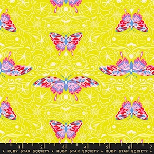 May include: A vibrant yellow fabric featuring a repeating pattern of colorful butterflies and ornate floral designs. The butterflies have red, blue, and pink wings. The text "RUBY STAR SOCIETY" is at the bottom.