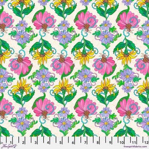 May include: A repeating pattern of stylized flowers in pink, yellow, and purple on a cream background. The design includes large pink flowers, yellow sunflowers, and clusters of purple blooms, connected by green stems and blue vines. The fabric has a 12-inch ruler at the bottom.