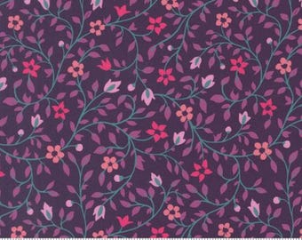 May include: Dark purple fabric with a floral pattern. The design features pink and red flowers, green stems, and purple leaves. The fabric is marked with a ruler and the Moda Fabrics logo.