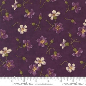 May include: A fabric featuring a floral pattern in shades of purple and white, with yellow centres, set against a deep purple backdrop. Green stems and buds are also visible. The fabric is measured in inches.