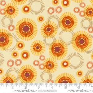 May include: Cream-colored fabric with a repeating pattern of stylized orange and yellow flower-like shapes. The design includes concentric circles and radial lines, creating a retro, floral aesthetic. A ruler is at the bottom.