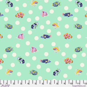 May include: A fabric pattern featuring colorful fish illustrations on a light teal background with large white polka dots. The fish are various species, including clownfish and angelfish. The fabric is marked with a ruler in inches.