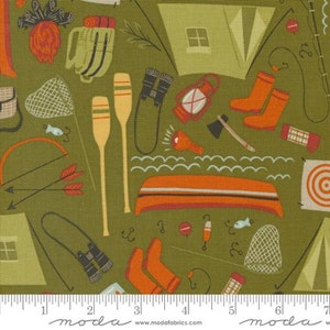 May include: Olive green fabric with a repeating pattern of camping and outdoor adventure elements. The design includes tents, canoes, oars, fishing gear, and campfires in shades of orange, tan, and black.
