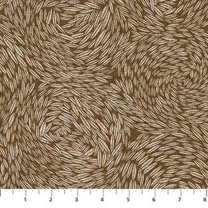 May include: Brown fabric with a swirling pattern of cream-colored, leaf-like shapes. The design is dense and covers the entire surface, creating a textured appearance. The fabric has a ruler along the bottom edge, with markings in inches.