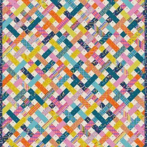 May include: A colorful quilt with a woven pattern. The design features intersecting bands in shades of yellow, orange, pink, teal, and navy blue, creating a vibrant and geometric composition. The quilt is bordered with a navy blue trim.