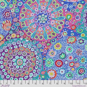 May include: A fabric print featuring large overlapping circles filled with intricate floral and mandala-like patterns in vibrant shades of pink, purple, blue, green, and orange. A white ruler at the bottom shows a scale of 30.5 cm.