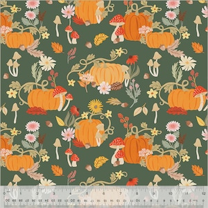 May include: A fabric pattern featuring orange pumpkins, red-capped mushrooms, and various flowers and leaves on a dark green background. The design includes daisies, sunflowers, and acorns, creating a fall or harvest theme.