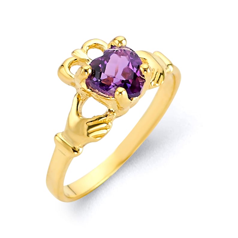 May include: A gold ring with a purple heart-shaped gemstone. The ring features a design of two hands clasped together, a traditional Irish Claddagh ring.