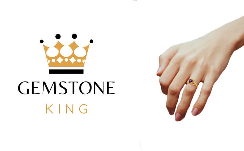May include: A gold ring with a purple gemstone set in a crown design. The ring is on a person's finger. The image also includes the logo for Gemstone King, which features a gold crown and the text "Gemstone King".