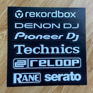 May include: A black background with white text logos for popular DJ software and hardware brands, including Rekordbox, Denon DJ, Pioneer DJ, Technics, Reloop, and Rane Serato.