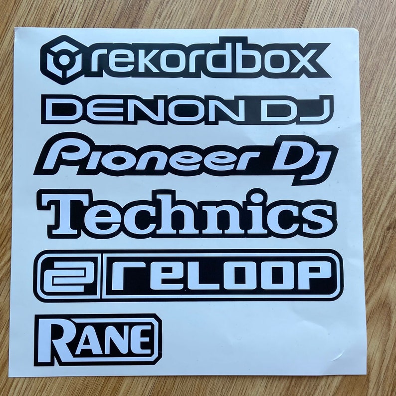 May include: A white sheet of paper with black text on it. The text includes the names of popular DJ equipment brands, such as Rekordbox, Denon DJ, Pioneer DJ, Technics, Reloop, and Rane.