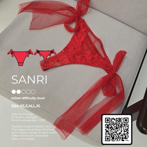 May include: Red lace thong with side tie ribbons. The thong features a floral lace design and is adorned with red ribbon bows. The text "SANRI" is visible, along with size options XS to XL. A QR code and the words "watch video guide" are also present.