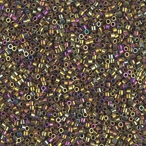 May include: A close-up image of a large quantity of small, round, metallic beads. The beads are a mix of gold and purple iridescent colors.