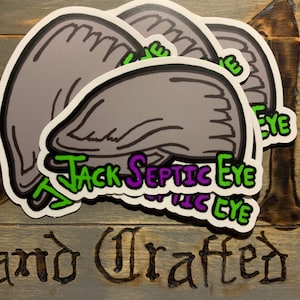 Puede incluir: Tres pegatinas grises y blancas con un ojo de dibujos animados y el texto "Jack Septic Eye" en letras verdes, moradas y blancas.