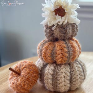 Small, medium, and large crochet pumpkins made with bulky yarn, ribbing, and puff stitch, perfect for Thanksgiving table decor