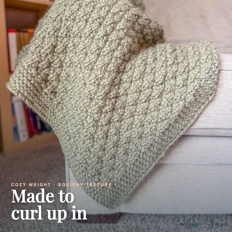 May include: A sage green crocheted blanket featuring a thick, textured stitch pattern. The blanket is draped over a light-coloured piece of furniture. Text on the image reads: COZY WEIGHT &middot; SQUISHY TEXTURE Made to curl up in.