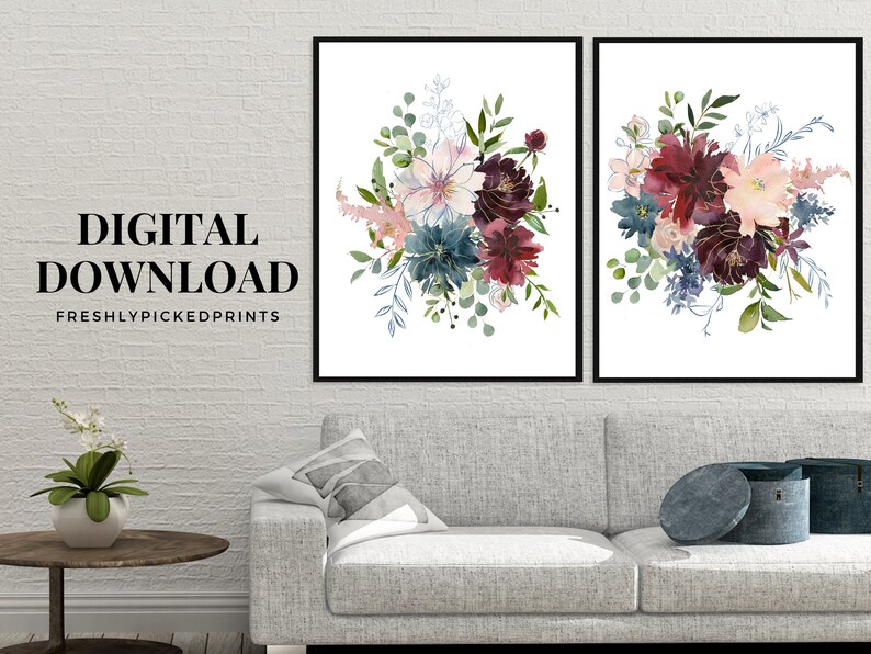 May include: Two framed floral art prints. Each print features a watercolor bouquet with burgundy, blue, and pink flowers, accented by green foliage. The text "DIGITAL DOWNLOAD" and "FRESHLYPICKEDPRINTS" are displayed on the left print.