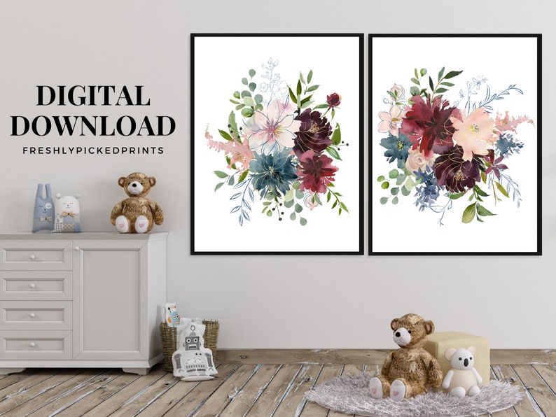 May include: Two framed floral art prints. Each print features a watercolor bouquet with pink, burgundy, and teal flowers, accented with gold details and green foliage. The text "DIGITAL DOWNLOAD" and "FRESHLYPICKEDPRINTS" are visible.