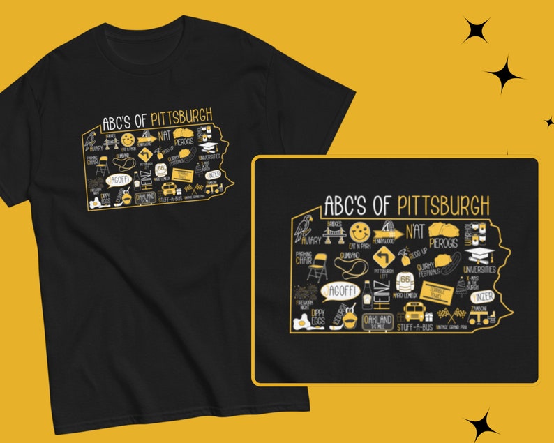 May include: Black t-shirt with a yellow graphic of the state of Pennsylvania with the text "ABC's of Pittsburgh" and various icons representing Pittsburgh, such as the incline, Heinz ketchup, and the Pittsburgh Steelers.