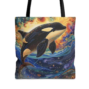 May include: A black and white orca whale swimming through a colorful galaxy-like pattern. The orca is silhouetted against a bright yellow and orange sunset. The tote bag is made of canvas and has black handles.