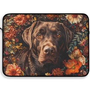 May include: A chocolate Labrador Retriever dog with brown eyes, surrounded by a wreath of colorful flowers. The dog is looking directly at the camera.