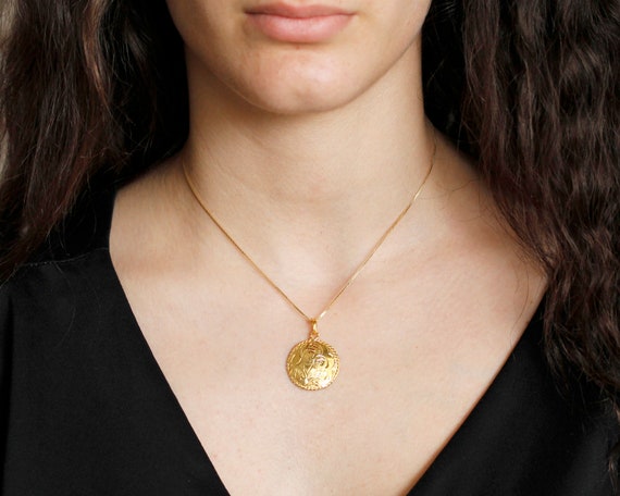 Religious coin necklace deals
