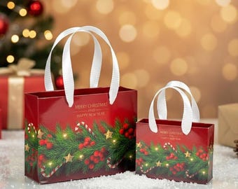 May include: Two red gift bags with white ribbon handles, featuring a printed design of green pine branches, red berries, gold stars, and candy canes. The text Merry Christmas and Happy New Year is printed in gold on the front of each bag.