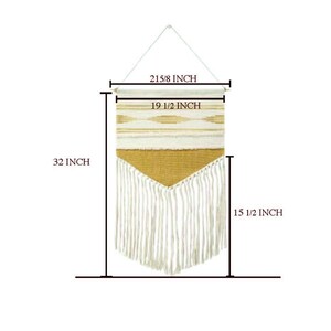 May include: A woven wall hanging with a cream and gold geometric design. The wall hanging is 32 inches long, 19 1/2 inches wide, and has a fringe at the bottom. The hanging rod is 21 5/8 inches wide.