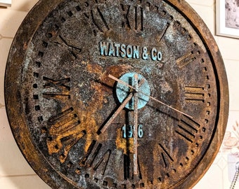 A cast iron style industrial inspired clock