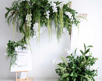Greenery and white floral wedding arch, artificial floral arrangement, festival event or business display