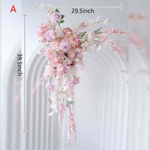 May include: A floral arrangement featuring pink and lavender flowers, measuring 39.5 inches in height and 29.5 inches in width. The arrangement includes roses, hydrangeas, and cascading blossoms, suitable for weddings or event decor.