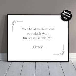 May include: A framed black and white print featuring the quote "Manche Menschen sind es einfach wert, für sie zu schmelzen." by Disney. Decorative flourishes are in the corners. A digital download PDF label is in the upper right corner.