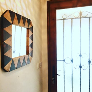 Decorative mirror with wooden frame