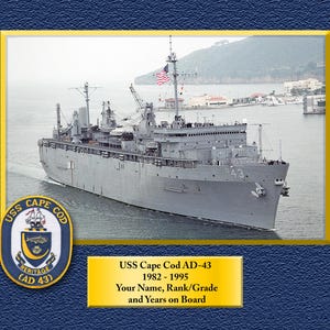 May include: A framed image of the USS Cape Cod AD-43, a gray naval vessel, sailing on water. The American flag flies from a mast. The image includes the ship's name, dates of service, and a ship's crest.
