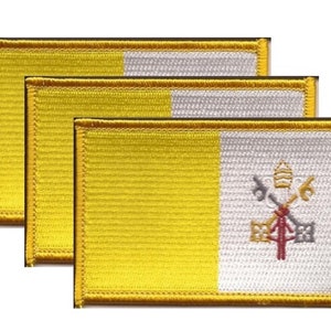 May include: Three embroidered patches featuring the flag of Vatican City. Each patch has a yellow vertical stripe on the left and a white vertical stripe on the right, with the Vatican coat of arms. The patches have a gold border.
