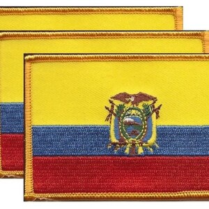 May include: Three embroidered patches featuring the flag of Ecuador. Each rectangular patch has a yellow upper section, a blue middle section, and a red lower section. The Ecuadorian coat of arms is centered on the yellow field. The patches are bordered with gold thread.
