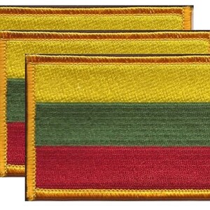 May include: Three rectangular embroidered patches featuring the flag of Lithuania. Each patch displays horizontal stripes of yellow, green, and red, with a gold border. The patches are likely for clothing or accessories.