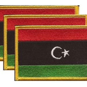 May include: A set of three ceramic mugs with a speckled, matte finish. The mugs are in shades of cream, light gray, and dark gray. Each mug has a simple, minimalist design and a rounded handle.