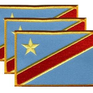 May include: Three embroidered patches featuring the flag of the Democratic Republic of the Congo. Each patch has a light blue background with a red diagonal stripe, a gold star, and a gold border. The patches are rectangular.