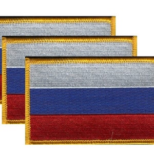 May include: Three rectangular patches featuring the Russian flag design. Each patch has horizontal stripes in white, blue, and red, with a gold border. The patches are arranged in a slightly overlapping pattern, showcasing the flag's colors.