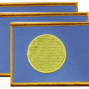 May include: Three rectangular patches with a blue background and a yellow circle in the center. Each patch has a gold border. The patches are stacked, showing the design in a layered effect.