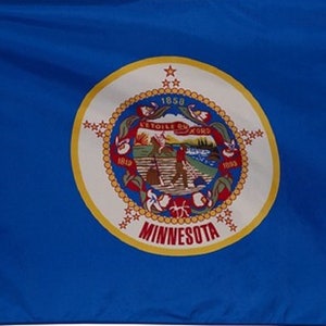 May include: A blue flag featuring the state seal of Minnesota. The seal is a circular design with a white background, a gold border, and the text "MINNESOTA". The flag has a white hoist.