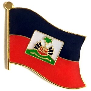 May include: A pin featuring the flag of Haiti. The pin has a gold border and depicts the flag with a blue upper section, a red lower section, and a white square in the center with a coat of arms.