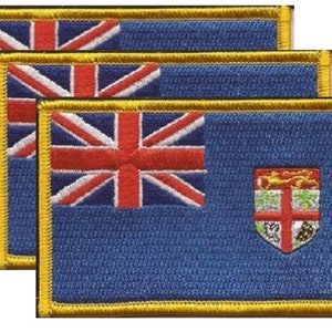 May include: Three embroidered patches featuring the flag of Fiji. Each patch has a blue background with the Union Jack in the upper left corner and the Fijian coat of arms on the right. The patches are rectangular with a gold border.