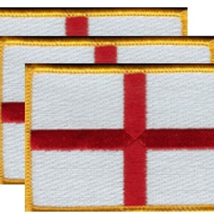 May include: Three rectangular patches featuring the flag of England. Each patch has a white background with a red cross, and a gold border. The patches are likely for clothing or accessories.