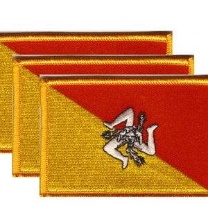 May include: Three embroidered patches featuring the flag of Sicily. Each patch has a gold border and a design that includes a red and gold background with a triskeles symbol.