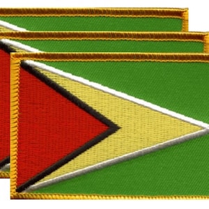 May include: Three embroidered patches featuring the flag of Guyana. Each patch has a green background with a yellow arrow, a red triangle, and black and white borders. The edges are trimmed with gold thread.